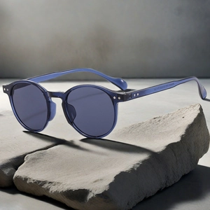 Detail view of model numbers and dimensions printed on translucent blue sunglasses arm