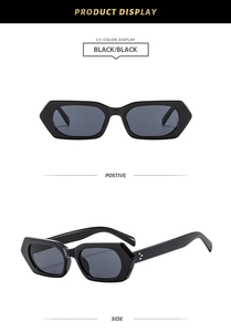 Detail of black vintage rectangle sunglasses with signature triple metal rivet accents
