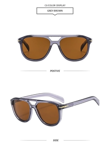 Detail view of grey square pilot sunglasses with double bridge and gold arrow metal accents