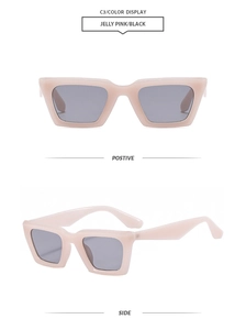 Détail de lunettes de soleil rectangulaires rose gelée avec monture large et verres