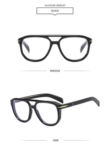 Detail view of black square double-bridge aviator frames with gold metal temple accents