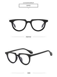Classic black oval frame sunglasses with vintage style and glossy finish details