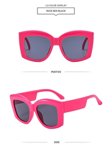 Detail view of rose red wide frame sunglasses with dark lenses from front and side angles