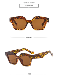 Detail view of demi brown square sunglasses with tea-colored lenses and thick frames