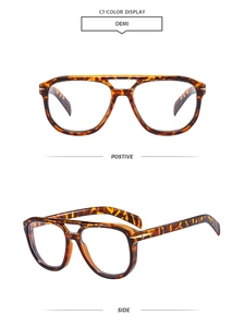 Detail view of retro double-bridge pilot glasses in tortoiseshell finish with metal hinges