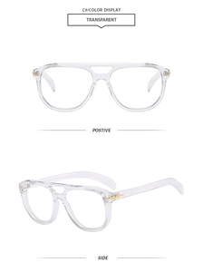 Detail view of transparent double bridge aviator frames with gold arrow metal accents