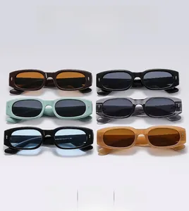 Detailed flat lay of small oval sunglasses in six colors with metal arrow rivets