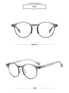 Detailed front and side views of transparent grey oval eyeglass frames with metal rivets