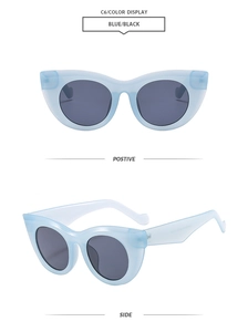 Detail view of cat eye sunglasses in light blue transparent frames with dark lenses