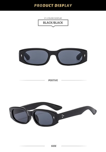 Detail view of oval black sunglasses with silver teardrop and star rivet accents