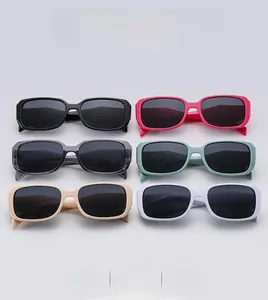 Flat lay of retro square sunglasses in black, pink, grey, mint green and white colors