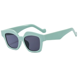 Chic mint green oversized geometric sunglasses with dark lenses for retro fashion style