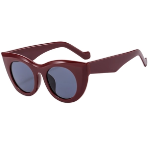 Fashionable burgundy cat eye sunglasses with thick frames and dark grey lenses for women