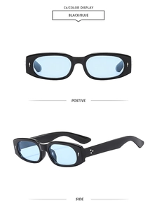 Detail of oval sunglasses featuring silver diamond rivets and blue tinted lenses