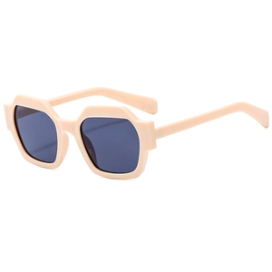 Modern geometric polygonal sunglasses with nude beige frames and dark grey lenses for women