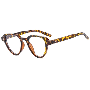 Retro tortoise shell sunglasses with metal rivets and transparent lenses on white base