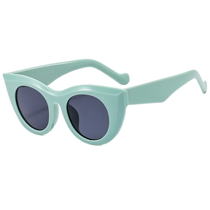 Fashionable mint green cat-eye sunglasses with dark grey lenses and UV protection