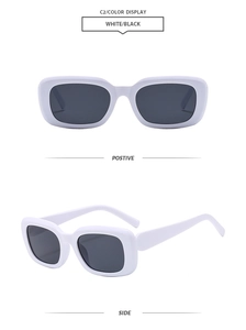 Detail view of white thick frame rectangular sunglasses with dark lenses in retro style