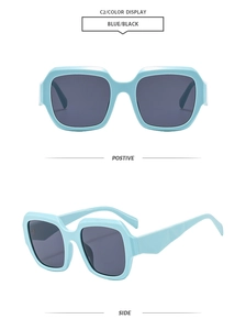 Detail view of square oversized light blue sunglasses with dark lenses and thick frame
