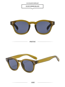 Detail of vintage round sunglasses in olive green with silver metal rivets and grey lens