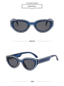 Detailansicht der Cat-Eye-Sonnenbrille mit blauem Rahmen und weißen Zierstreifen