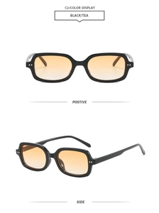 Vue détaillée des lunettes de soleil carrées noires avec verres dégradés thé et rivets