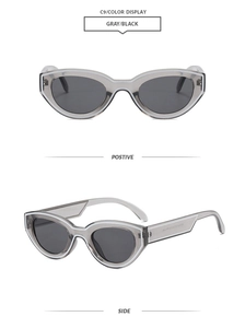 Detailansicht der Cat-Eye Hip-Hop Sonnenbrille mit grauem Rahmen und schwarzen Gläsern
