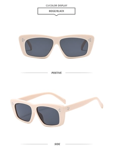 Detailansicht der beigen klobigen quadratischen Sonnenbrille mit silbernen Nieten und Gläsern