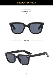 Close-up of classic black square sunglasses with silver rivets and side temple details
