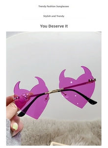 Detailed view of purple devil heart-shaped rimless lenses with gold metal bridge