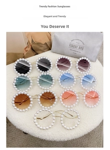 Close-up of luxury round sunglasses with pearl frame and multi-color gradient lenses
