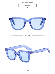 Detail view of transparent blue square sunglasses with silver metal arrow rivets