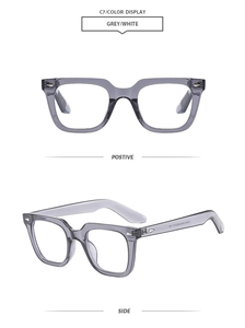 Detail view of grey translucent square frame sunglasses showing side rivet decoration