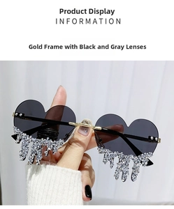 Detail of heart-shaped sunglasses with shimmering rhinestone teardrop fringe accents