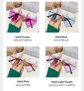 Detailed view of four frameless flame-shaped sunglasses with diamond-studded edges