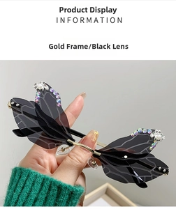 Detail of dragonfly wing sunglasses with gradient rhinestones and pearl embellishments