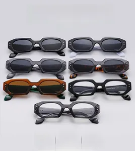 Detailed view of polygon sunglasses in seven colors with silver rivet decorations