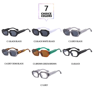 Flat lay display of geometric oversized sunglasses in seven diverse color combinations