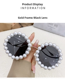 Detail of luxury round gold metal sunglasses with elegant white pearl frame embellishment