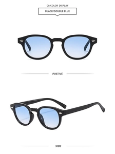 Detail of oval vintage sunglasses with black frames and blue gradient lenses