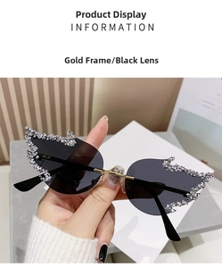 Detail of flame-shaped rimless sunglasses with gold metal frame and rhinestones