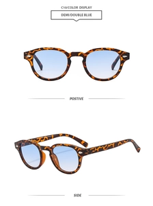 Detailed view of tortoiseshell oval frame sunglasses with light blue gradient lenses
