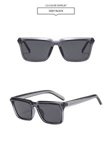 Detail view of transparent grey square frame sunglasses with black lenses and sleek temples