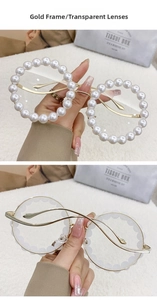 Close-up of gold metal wave-shaped temples and pearl-embellished round glasses frame