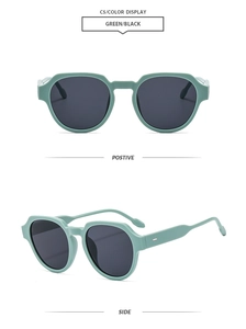 Détail de lunettes de soleil rétro vert menthe avec branches larges et verres gris