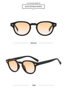 Detail view of retro oval sunglasses with C15 black frame and double orange gradient lenses