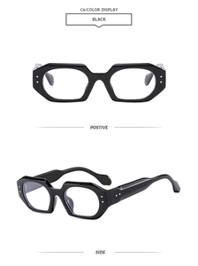 Detail view of bold geometric black sunglasses frames with silver decorative dots