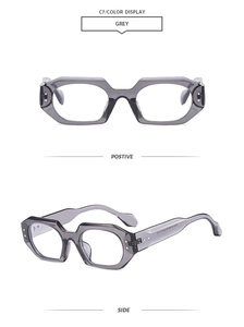Detail of grey hexagonal sunglasses frames showing the front and side view angles