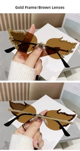 Detail of flame-shaped rimless sunglasses with gold frame brown lens and glitter trim