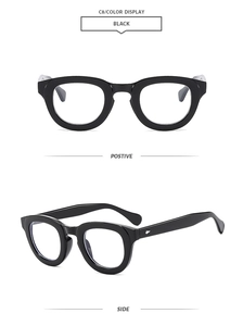 Macro detail of thick black oval frames with silver rivet accents and side view perspective